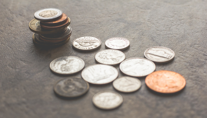 Canva - Assorted Silver-and-gold-colored Coins on Gray Surface